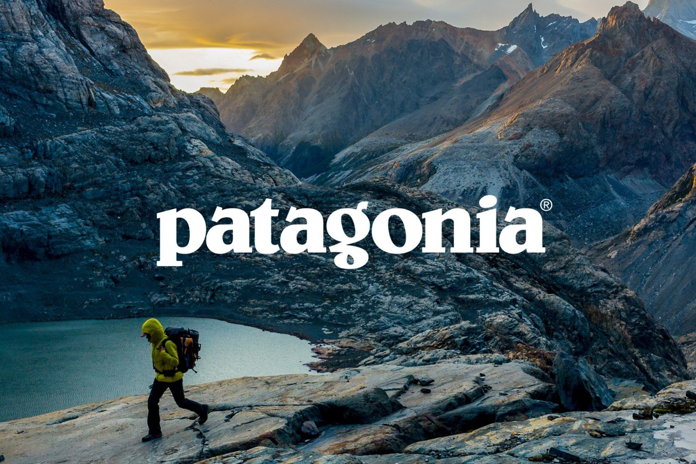 A branded image featuring a man hiking in the mountains for the clothing brand Patagonia